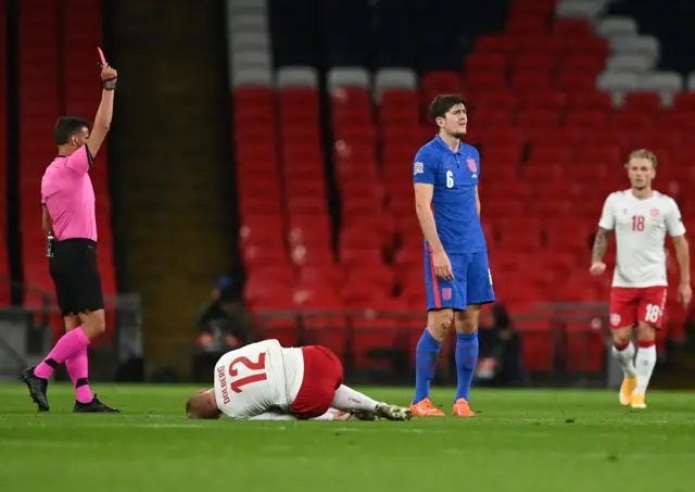 Harry Maguire is shown a red card