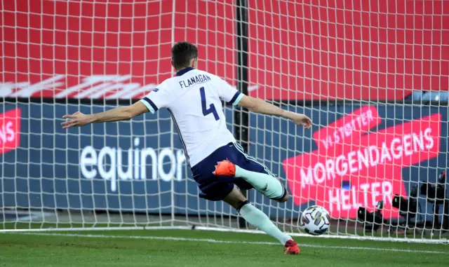 Northern Ireland's Tom Flanagan clears the ball off the line