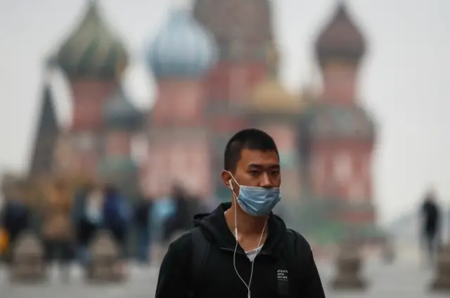 A man wears a mask in Moscow