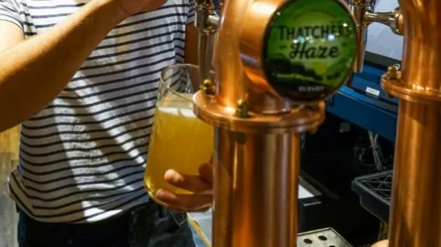 Man pulling pint