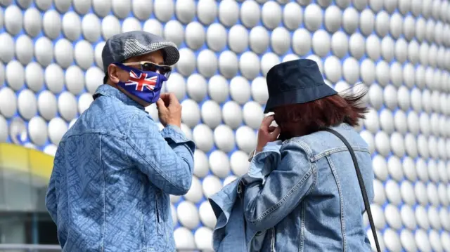 People in Birmingham in masks