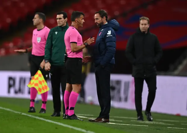 Gareth Southgate, Manager of England speaks with match referee Jesus Gil Manzano