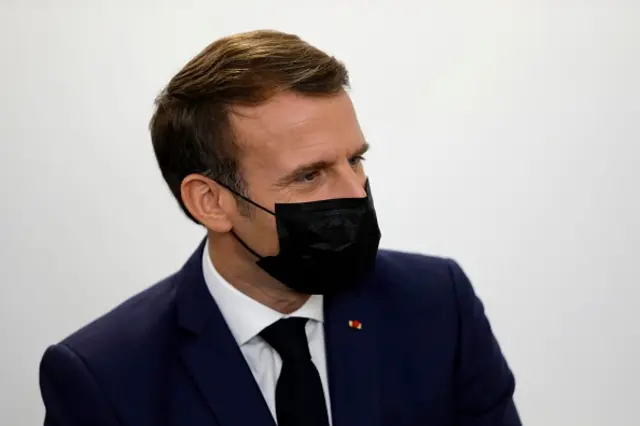 French President Emmanuel Macron, wearing a face mask