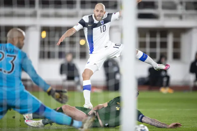 Teemu Pukki gets a shot away despite Shane Duffy's efforts