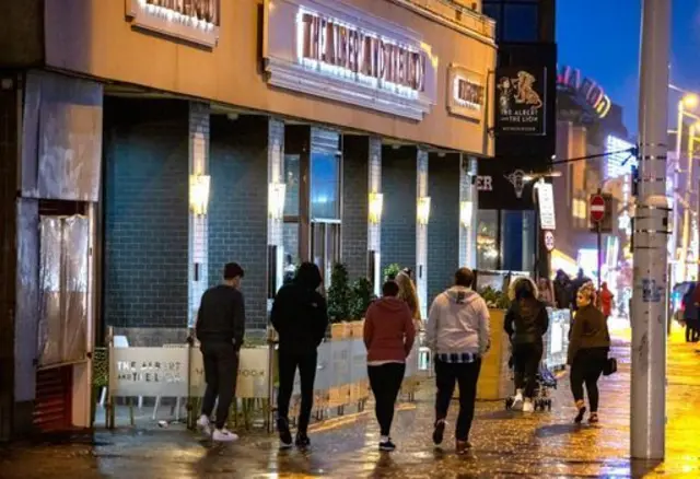 People outside a pub in Blackpool