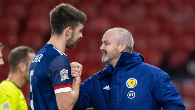 Declan Gallagher gets a hearty handshake from Steve Clarke at full-time