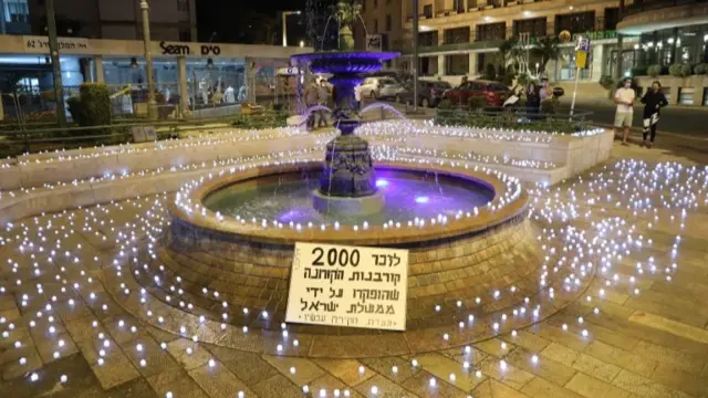 Electronic candles placed in a square near the prime minister's residence in Jerusalem in memory of the more than 2,000 people who have died from Covid-19 in Israel