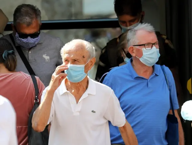 People wear face masks in Croatia