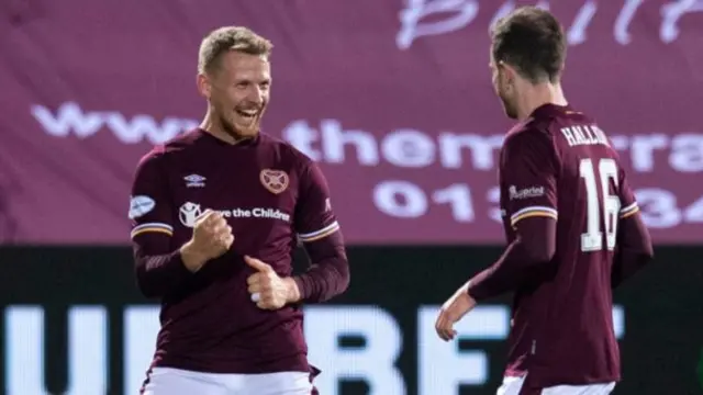 Hearts' Stephen Kingsley (left) celebrates scoring