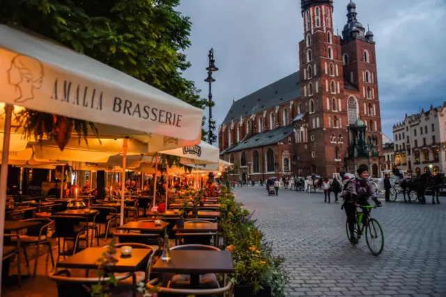 Empty tables of a restaurant are pictured on Krakow's main square on 7 October 2020 in Krakow, Poland