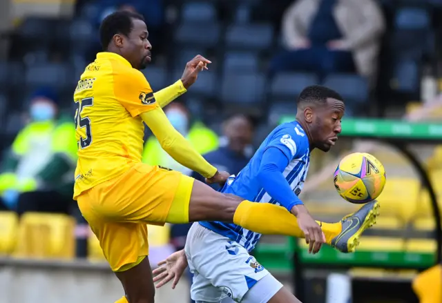 Kilmarnock's Nicke Kabamba is challenged by Livingston's Efe Ambrose