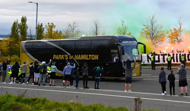 Celtic fans greet the team bus