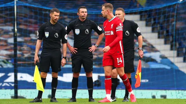 Jordan Henderson and officials