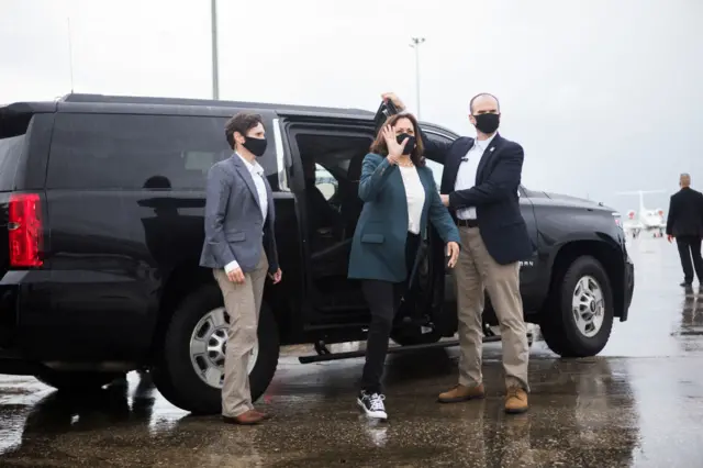 Kamala Harris prepares to board her airplane at the Orlando International Airport