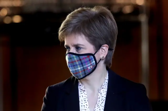 Nicola Sturgeon wearing a face covering