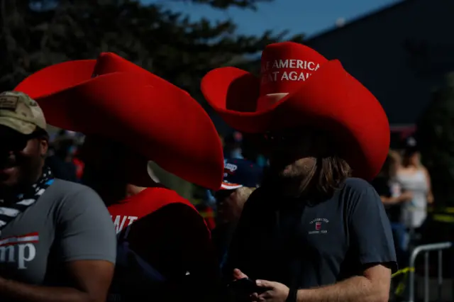 Supporters wear Make America Great Again stetsons