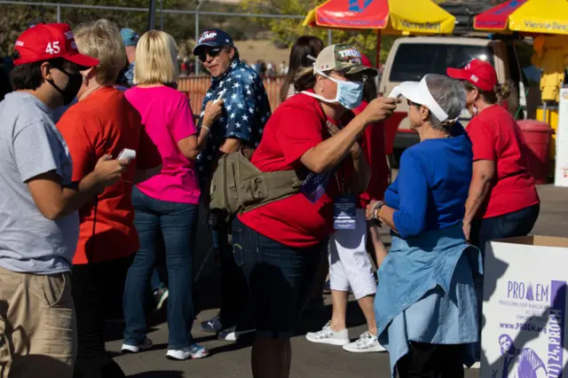 People have their temperatures checked before they attend a "Make America Great Again" campaign rally held by U.S. President Donald Trump at the Prescott Regional Airport on October 19, 2020 in Prescott, Arizona.