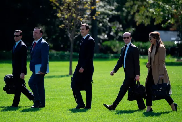 Walking to Marine One on 30 September after, from left to right, Director of Oval Office Operations Nicholas Luna, Deputy Chief of Staff Dan Scavino, Senior Adviser Jared Kushner and Stephen Miller, and Aide Hope Hicks