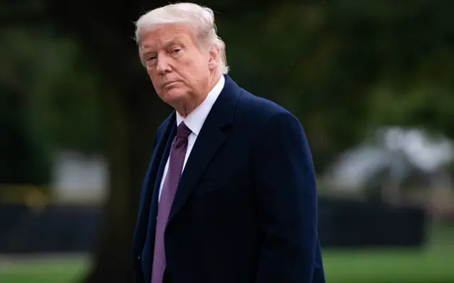 US President Donald Trump walks from Marine One after arriving on the South Lawn of the White House in Washington, DC, October 1, 2020