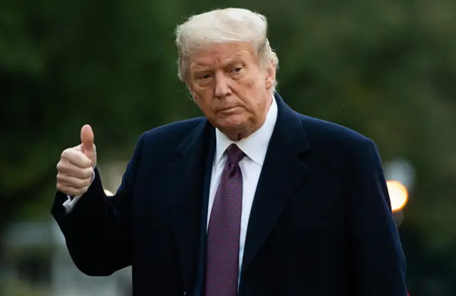 US President Donald Trump gives a thumbs up as he walks from Marine One after arriving on the South Lawn of the White House in Washington, DC, October 1, 2020