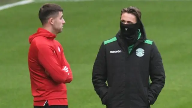 Hamilton goalkeeper Kyle Gourlay chats with Hibs' Scott Allan