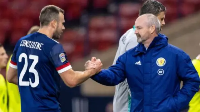 Andrew Considine is congratulated by Scotland head coach Steve Clarke