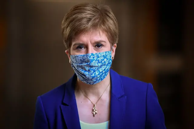 Nicola Sturgeon wearing a face covering