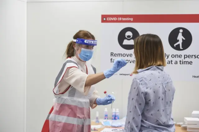 A person having a test at Heathrow Airport