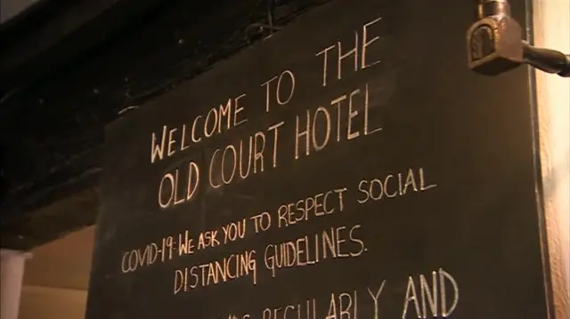 Sign welcoming people to the Old Court Hotel