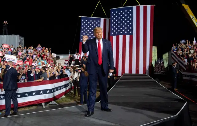 US President Donald Trump arrives to hold a Make America Great Again rally as he campaigns in Gastonia, North Carolina