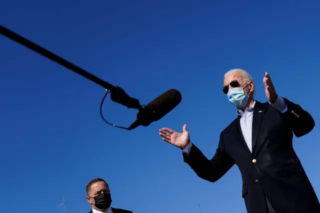 Democratic presidential nominee Joe Biden speaks to reporters before boarding his campaign plane at New Castle Airport on October 22, 2020 in New Castle, Delaware. Biden is traveling to Nashville, Tennessee for the final presidential debate with President Donald Trump