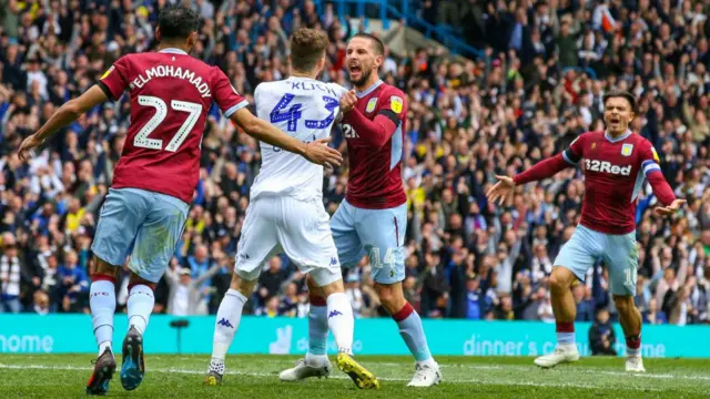 Aston Villa players protest Leeds United's opening goal in the Championship in April 2019