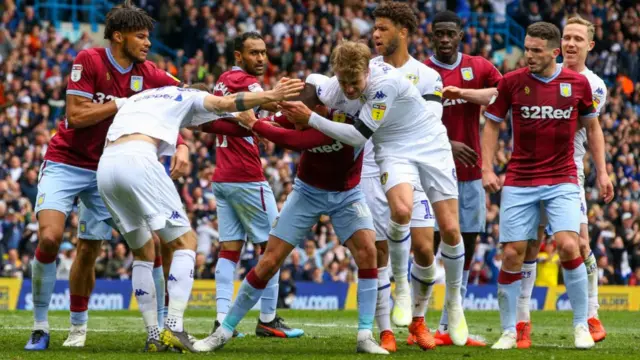 Aston Villa and Leeds United players clash following the hosts' contentious opening goal in the Championship in April 2019