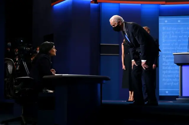 Joe Biden speaks with moderator Kristen Welker