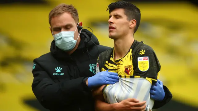 Stipe Perica (right) goes off with a shoulder injury