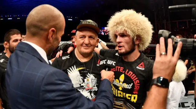 Abdulmanap and Khabib Nurmagomedov after Khabib's win over Dustin Poirier