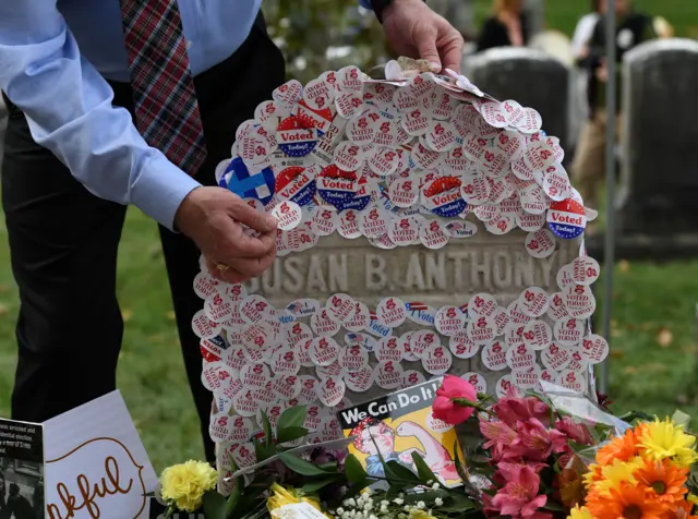 The grave of women's suffrage leader Susan B Anthony is covered with "I Voted" stickers in November 2016