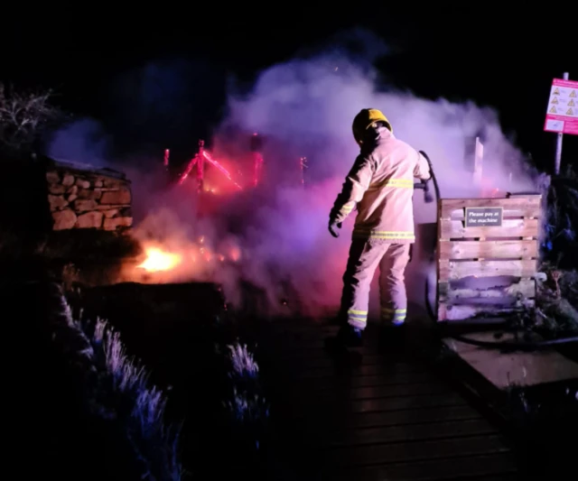 Firefighter in action at blaze