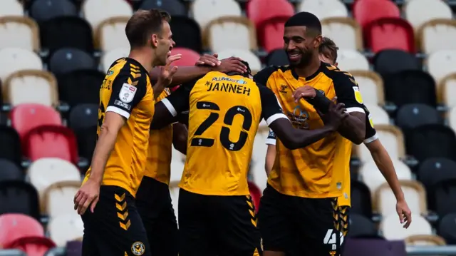 Newport County players celebrate a goal