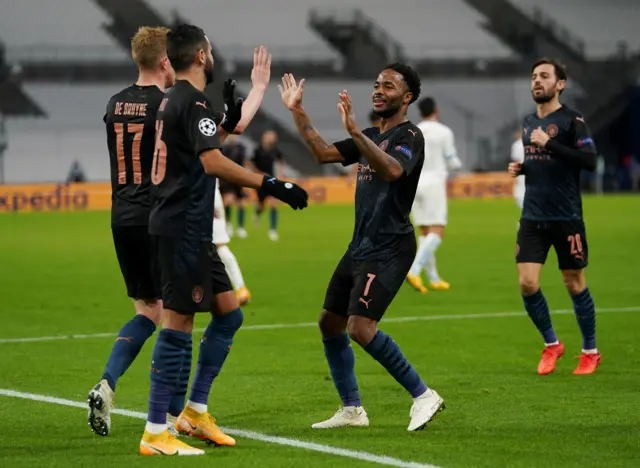 Raheem Sterling celebrates his goal with Kevin de Bruyne and Riyad Mahrez