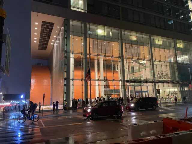 A line of people outside the New York City College of Technology