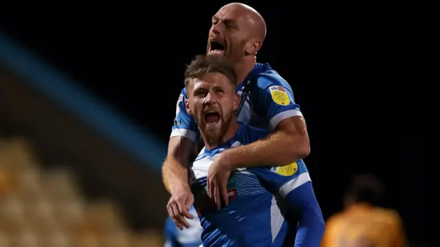 Patrick Brough celebrates a goal for Barrow