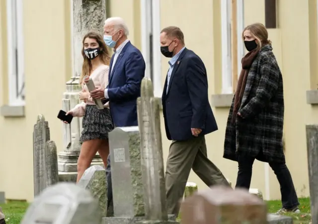 Joe Biden pictured leaving church on 25 October in Delaware with his granddaughters Natalie and Finnegan