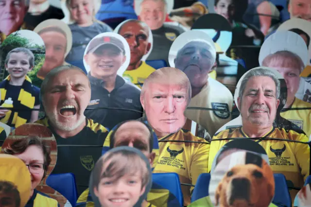 A cutout of Trump's face at the July semifinal match between Oxford United and Portsmouth FC