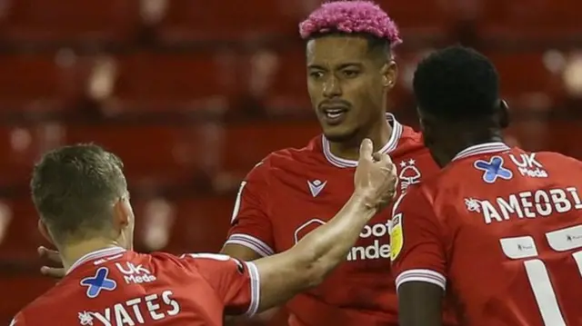 Lyle Taylor celebrates