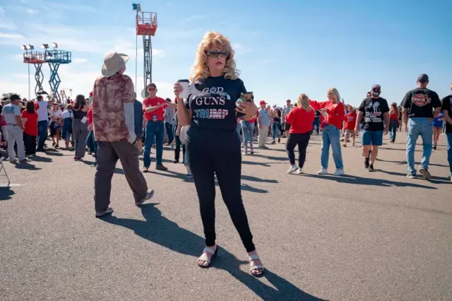 Supporters wait to hear US President Donald Trump speak at an earlier airport rally in Arizona on 19 October