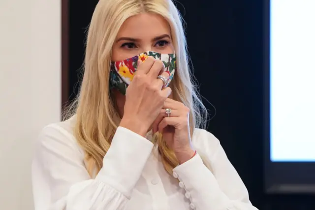 Senior White House Advisor Ivanka Trump puts on a mask during the Pledge To America's Workers Presidential Award in the Eisenhower Executive Office Building