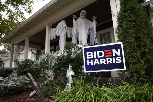 Joe Biden supporters in Nashville, Tennessee decorate their garden with election sign and ghostly figures