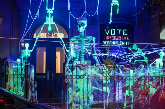 A house in New York City with a neon skeleton