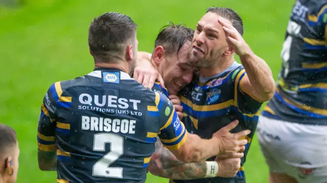 Leeds's Luke Gale (right) celebrates Tom Briscoe's try against Wigan with Richie Myler